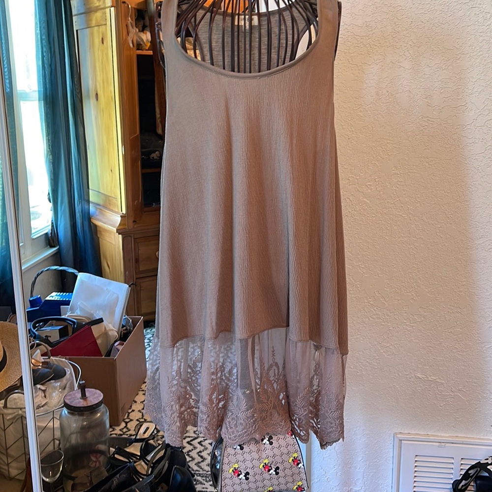 Large top can be worn under a dress
